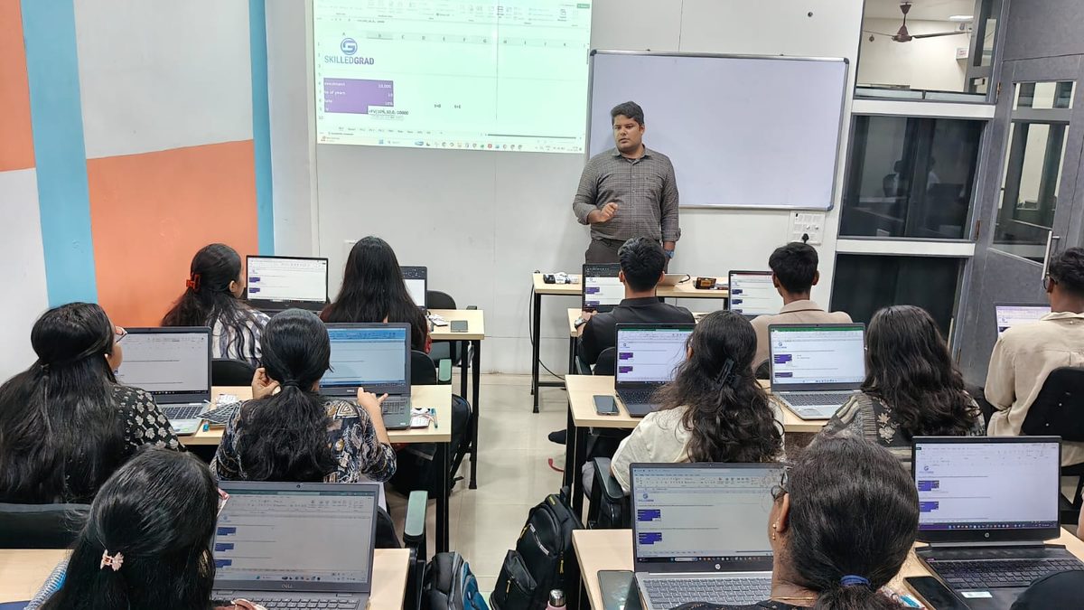 Faculty taking students through an Excel valuation exercise at SkilledGrad